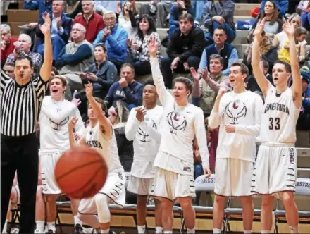  ?? PETE BANNAN — DIGITAL FIRST MEDIA ?? The Conestoga bench reacts to a made three-pointer in the fourth quarter against Penncrest on Friday.