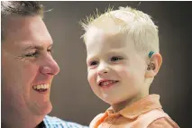  ?? WAYNE CUDDINGTON ?? Parker McKay, 3, with his dad, Ryan McKay, was diagnosed with hearing loss when he was four months old.