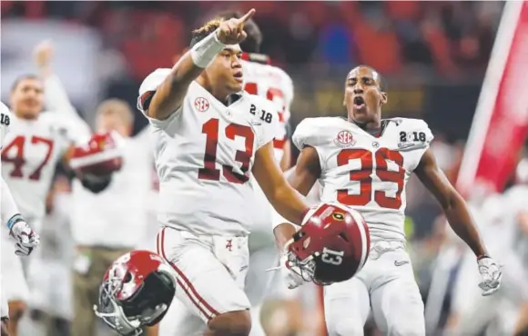  ?? Jamie Squire, The Associated Press ?? Freshman quarterbac­k Tua Tagovailoa shows who’s No. 1 after throwing the winning touchdown pass for Alabama on Monday night.