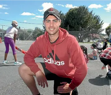  ?? NICHOLAS BOYACK/ STUFF ?? South African import Travis Muller is helping coach children as he chases his dream of playing for the Black Caps.