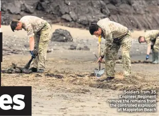  ??  ?? Soldiers from 35 Engineer Regiment remove the remains from the controlled explosion at Mappleton Beach