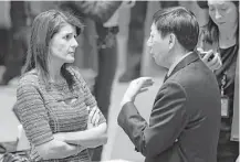  ?? Mark Lennihan / Associated Press ?? U.S. Ambassador to the United Nations Nikki Haley discusses sanctions Friday with Chinese Deputy Ambassador Wu Haitao.