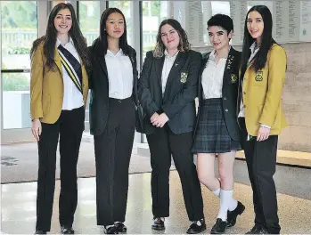  ?? NICK PROCAYLO ?? From left, Maggie Coval, Amanda Lim, Maren Gilbert Stewart, Ysabelle Delgado and Kira Tosefsky model the uniform at York House school. Starting in September, pants will be part of the uniform.