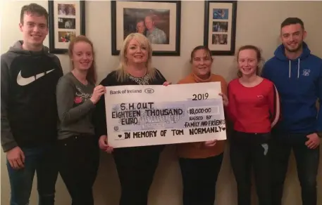  ??  ?? The Normanly family; Padraig, Mariah, Marie, Lauren and Brian handing over the cheque of €18,000 to nurse Mary O’Brien
