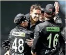  ?? ?? Tim Southee, centre, celebrates a wicket last night.