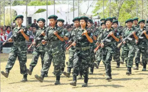  ??  ?? The Women Arms wing of the separatist National Socialist Council of Nagaland-isak Muivah (NSCN-IM) marches during the 35th Naga Republic Day on March 21, 2014 GETTY IMAGES