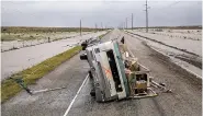  ?? TAMIR KALIFA/THE NEW YORK TIMES ?? An RV destroyed by Hurricane Harvey sits Saturday on a highway outside Rockport, Texas. Rockport, a coastal city of about 10,000, was in the hurricane’s path when it came ashore late Friday.