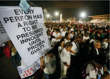  ?? AP FOTO ?? PRO-LIFE RALLY. Around 10,000 Catholics marched around Manila’s Rizal Park yesterday to oppose the revival of the death penalty now looming in congress. The Catholic church expressed alarm over the killing of 7,000 in the drug war.