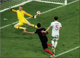  ?? ASSOCIATED PRESS ?? CROATIA’S MARIO MANDZUKIC (second right) scores his side’s second goal during Wednesday’s semifinal match between Croatia and England in the Luzhniki Stadium in Moscow, Russia.