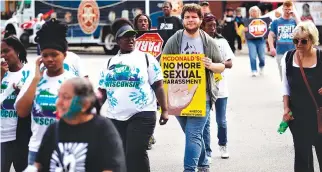  ?? AFP ?? MCDONALD’S EMPLOYEES and other fastfood chain workers protest against sexual harassment in the workplace on Sept. 18 in Chicago, Illinois. McDonald’s workers in 10 US cities staged a one-day strike Tuesday inspired by the #MeToo movement, alleging the fastfood giant does not adequately address pervasive sexual harassment at its stores.