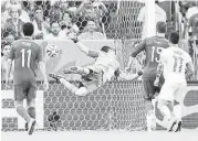  ?? Martin Bernetti / Afp/getty Images ?? Spain goalkeeper Iker Casillas fails to stop a shot by Chile in the first half Wednesday. After the match, Casillas asked for forgivenes­s from Spain’s fans.