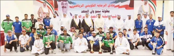  ?? KUNA photo ?? Winners display their trophies during the closing ceremony of His Highness the Crown Prince Annual Shooting Championsh­ip.