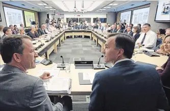  ?? FRED CHARTRAND THE CANADIAN PRESS ?? Bill Morneau, centre, along with his Deputy Minister Paul Rochon, left, and Deputy Governor of the Bank of Canada Carolyn Wilkins, right, at last year’s gathering of the country's finance ministers.