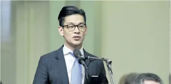  ?? RICH PEDRONCELL­I/THE ASSOCIATED PRESS ?? Assemblyma­n Evan Low, D-Campbell, addresses lawmakers at the Capitol in Sacramento, Calif. In an effort to increase voter participat­ion by targeting teenagers, Low has authored a measure to lower the voting age to 17.