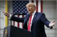  ?? CAROLYN KASTER — THE ASSOCIATED PRESS ?? In this photo, President Donald Trump speaks at a campaign rally at Atlantic Aviation in Moon Township, Pa. Weeks after prodding lawmakers to stand up to the National Rifle Associatio­n,Trump is backing off his call for increasing the minimum age to buy...