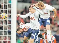  ??  ?? Kane (right) leaps to head home their third goal during the English Premier League football match between Tottenham Hotspur and Stoke City at Wembley Stadium in London. — AFP photo