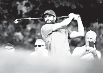  ?? Nathan Denette/The Canadian Press via AP ?? TEE. Adam Hadwin, of Canada, watches his tee shot on the seventh hole during the pro-am at the Canadian Open golf tournament at the Glen Abbey Golf Club in Oakville, Ontario, Wednesday, July 25, 2018.