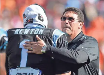  ?? KYLE TERADA, USA TODAY SPORTS ?? “I’m anxious to see him be him,” Panthers coach Ron Rivera, right, said about QB Cam Newton.