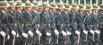  ?? REUTERS ?? ■ Army personnel wait in the rain to present the guard of honour to Sri Lanka's President Maithripal­a Sirisena, before he arrives to attend the Bimstec summit in Kathmandu, Nepal, on Wednesday.