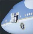  ?? — Reuters file photo ?? An Air Force officer opens the door of Air Force One as US President Barack Obama arrives at Joint Base Andrews from New Jersey and New York, in Maryland.