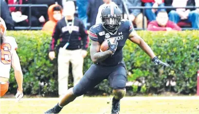  ?? SOUTH CAROLINA PHOTO ?? South Carolina running back Tavien Feaster looks for room during last November’s 38-3 loss to Clemson. The Gamecocks and Tigers have played annually since 1909 but wouldn’t this year if every Power Five conference adopted league-only schedules.