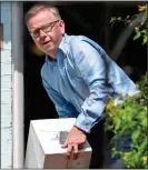  ??  ?? CHEERS: Mr Gove takes delivery