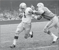  ?? PRESTON STROUP/AP PHOTO ?? In this Nov. 22, 1962, file photo, Green Bay Packers fullback Jim Taylor (31) is brought down by Dick Lane of the Detroit Lions in a game at Detroit. The Hall of Fame fullback died early Saturday. He was 83.
