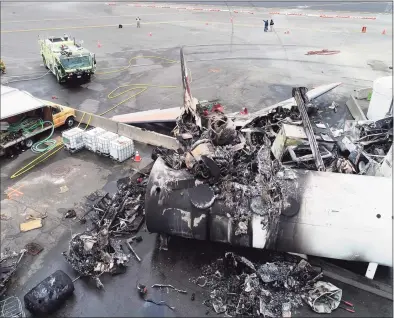  ?? Associated Press ?? The photos above and below, provided by the National Transporta­tion Safety Board, show damage from a World War II-era B-17 bomber plane that crashed on Oct. 2, 2019, at Bradley Internatio­nal Airport in Windsor Locks. Pilot error was the probable cause of the 2019 crash that killed seven people and wounded six others, the NTSB said in a report released Tuesday that also cited inadequate maintenanc­e as a contributi­ng factor. |