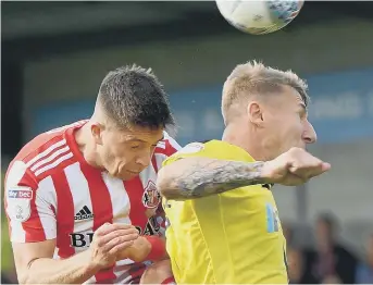  ??  ?? Lynden Gooch battles for a high ball.