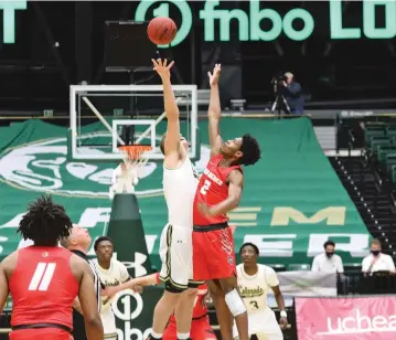  ?? PHOTOS COURTESY UNM ATHLETICS ?? Lobos junior point guard Saquan Singleton, right, rises for the opening tip against Colorado State on Wednesday in Fort Collins, Colo. The Lobos gave up a 21-2 run in the first half and lost 87-73 to the Rams in the regular season finale for both teams.