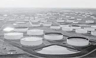  ?? Daniel Acker / Bloomberg file ?? Oil storage tanks dominate Cushing, Okla. Cushing, which prides itself as the “pipeline crossroads of the world,” is the biggest storage hub in the United States.