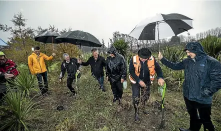  ?? BRADEN FASTIER/STUFF ?? NZ First MP Shane Jones and Labour MP Damien O’Connor visit Hoddy Estuary Park in July 2019, during an announceme­nt as part of the One Billion Trees programme.