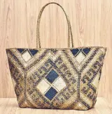  ??  ?? Eva Marie Arts and Crafts’ banig bags made from tikog reeds