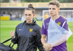  ?? Picture: Steve Terrell ?? Maidstone’s Jake Embery leaves the field at Folkestone with physio Beth Cooper