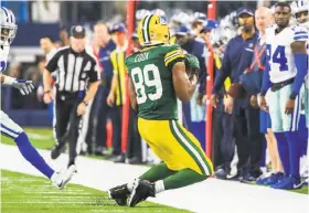  ?? Smiley N. Pool / Associated Press ?? Tight end Jared Cook makes a grab along the sideline to set up Green Bay’s winning field goal in a playoff game against Dallas in January.