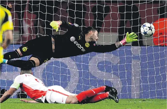  ?? Picture / AP ?? Radamel Falcao heads Monaco’s second goal beyond Dortmund keeper Roman Burki.