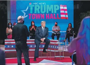  ?? Evan Vucci Associated Press ?? PRESIDENT TRUMP sits onstage during his NBC town hall at Pérez Art Museum Miami. His interactio­ns with moderator Savannah Guthrie were contentiou­s, and he was just as testy with some questions from voters.