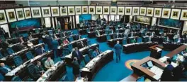  ?? WILFREDO LEE/AP ?? Members of the Florida House of Representa­tives work during a legislativ­e session at the Florida State Capitol on March 8, 2022, in Tallahasse­e.