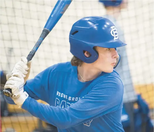  ?? KYLE TELECHAN/POST-TRIBUNE ?? Boone Grove’s Trey Pitcock works on his swing during practice Thursday.