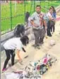  ?? HT ?? Aizawl FC fans clearing trash at the Shillong stadium.