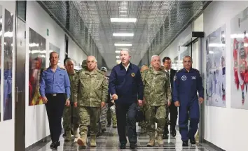  ?? Reuters ?? Turkish Defence Minister Hulusi Akar visits Land Forces Operation Centre in Ankara, Turkey, on Monday. He vowed to keep up operations against the Kurdish militants in Syria.