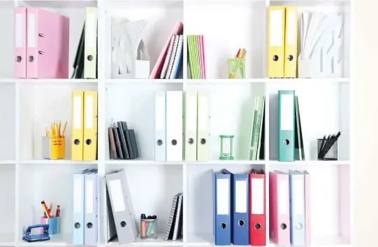  ??  ?? A depiction of perfectly co-ordinated books on shelves might look good in a design magazine, but don’t always strive for such glossy perfection, says profession­al organizer Nicole Anzia.