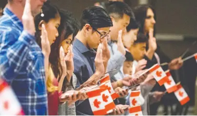  ?? GORD WALDNER ?? New Canadians study before taking the citizenshi­p test from the official Discover Canada study guide. Faculty members at the University of Toronto say the guide should be revised and updated, as the current version plays a role in propagatin­g racism.