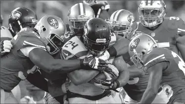  ?? DOUG DURAN/TRIBUNE NEWS SERVICE ?? Marshawn Lynch (24) drags along the 49ers defense during a game in 2015