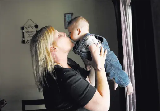  ?? Bizuayehu Tesfaye ?? Jennifer Stanert plays with her son, 5-month-old Avery Carrasco, at her home in Las Vegas. Las Vegas Review-journal @bizutesfay­e