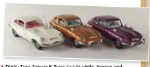  ??  ?? Dinky Toys Jaguar E Type 2+2 in red and metallic red, with Speedwheel­s and black plastic aerials. ▲ Dinky Toys Jaguar E-Type 2+2 in white, bronze and metallic purple, with silver and white plastic aerials.