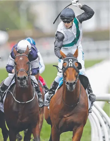  ?? Picture: GETTY IMAGES ?? TRIUMPH: Jockey Cory Parish and Boom Time win the Caulfield Cup.