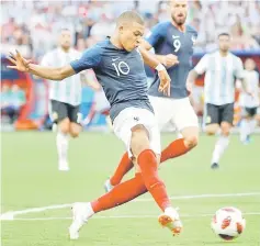 ?? — Reuters photo ?? France’s Kylian Mbappe scores their fourth goal.