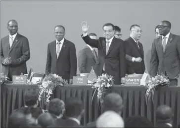  ?? WU ZHIYI / CHINA DAILY ?? Premier Li Keqiang (third from left), Prime Minister Jose Ulisses Correia e Silva of Cape Verde (second), Prime Minister Carlos do Rosario of Mozambique (first), and Prime Minister Baciro Dja of Guinea-Bissau (fourth) attend the opening ceremony of the...