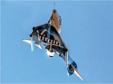  ??  ?? Virgin Galactic’s rocket plane VSS Unity returns to Mojave Air and Space Port in California after reaching space yesterday.